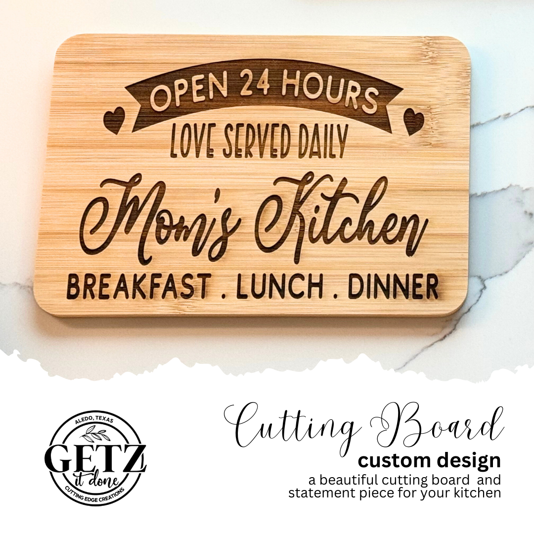 A wooden cutting board featuring the text: Open 24 Hours, Love Served Daily, Moms Kitchen, Breakfast, Lunch, Dinner with heart accents. Below, a logo reads Getz it done with additional text Cutting Board, custom design, a beautiful cutting board and statement piece for your kitchen.