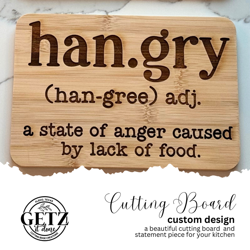 A wooden cutting board features the word hangry with pronunciation (han-gree) and defined as a state of anger caused by lack of food. Below is the Getz It Done logo with a Texas outline, advertising the custom cutting board design.