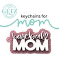 A glittery pink keychain in the shape of a home plate features the words baseball MOM in white. Above, the text keychains for mom is styled with mom in cursive writing. The background shows the logo of GETZ it done in green, with Aledo, Texas and Cutting Edge Creations around it.
