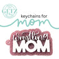 A glittery pink keychain with the words Wrestling MOM in white, bold and cursive letters. Above, text reads keychains for mom with a stylized line. The logo GETZ it done is in the upper left corner, noting Albedo, Texas, and Cutting Edge Creations.