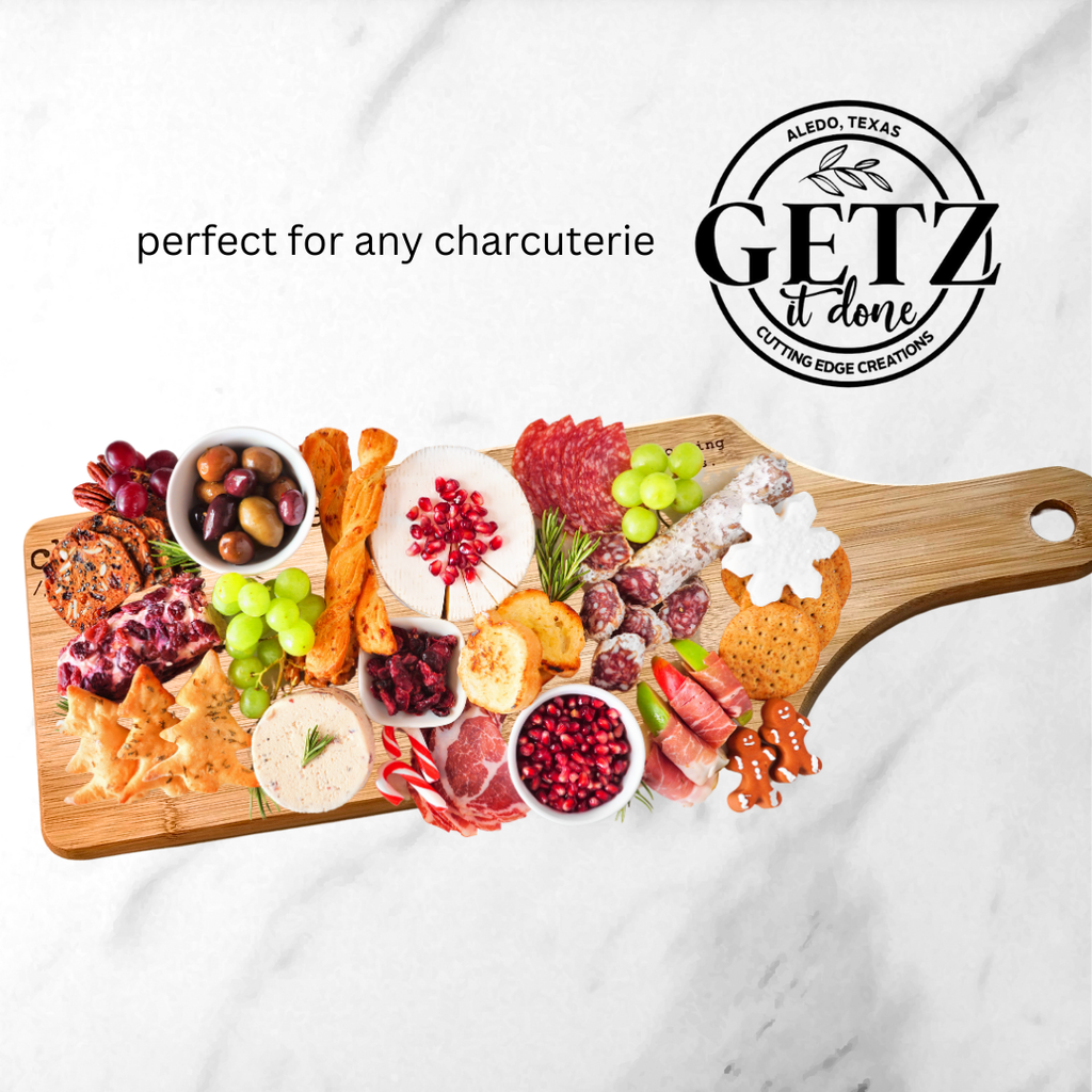 A wooden charcuterie board topped with a variety of foods, including cheeses, sliced meats, crackers, olives, nuts, grapes, and pomegranate seeds. The board features decorative elements in festive shapes. Text reads, perfect for any charcuterie and includes a logo for Getz it Done.