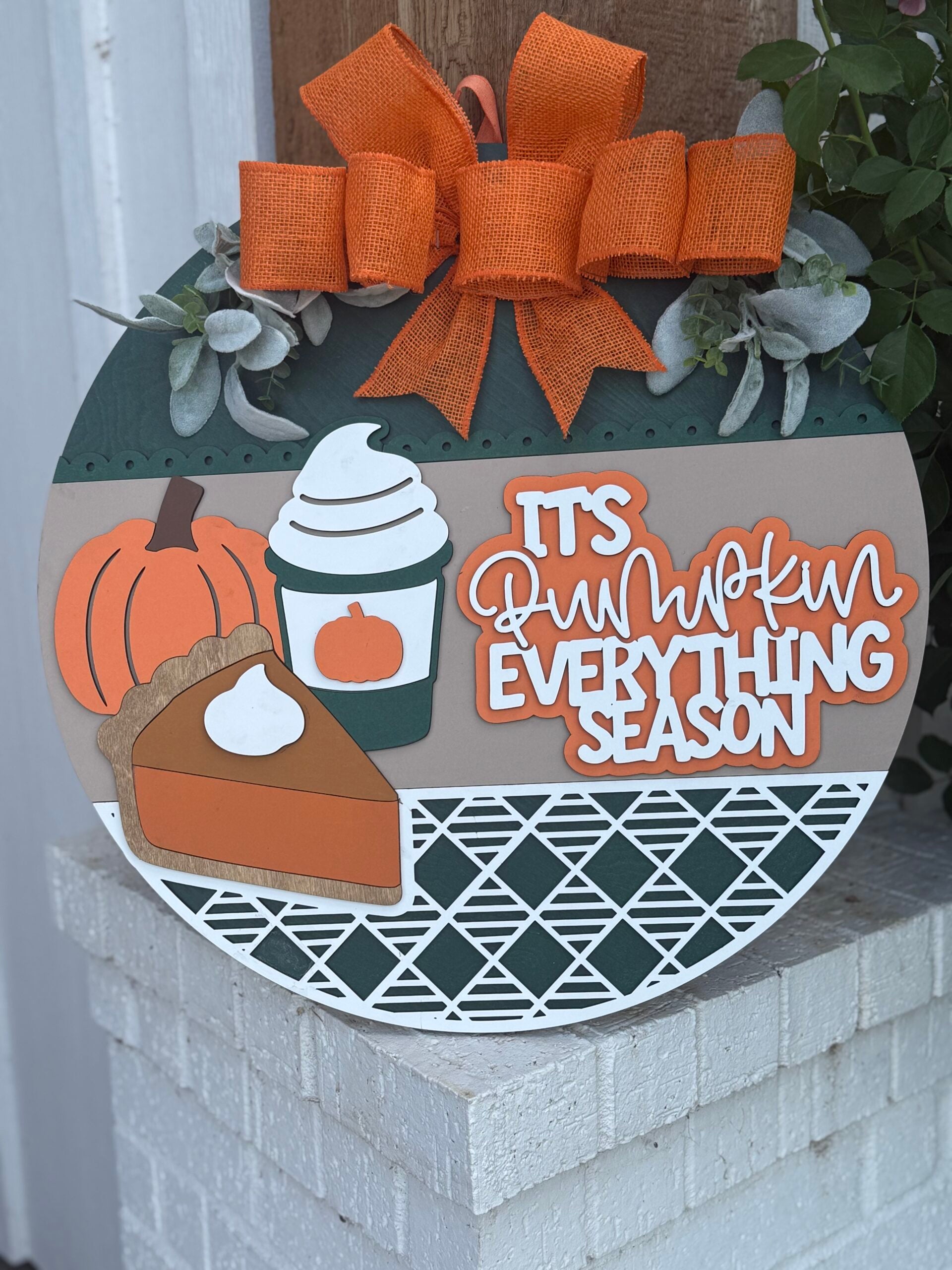 The "It’s Pumpkin Everything Season Door Sign" features pumpkin, pie, PSL, and an orange bow—laser cut wood decor perfect for your autumn farmhouse wreath or entryway.