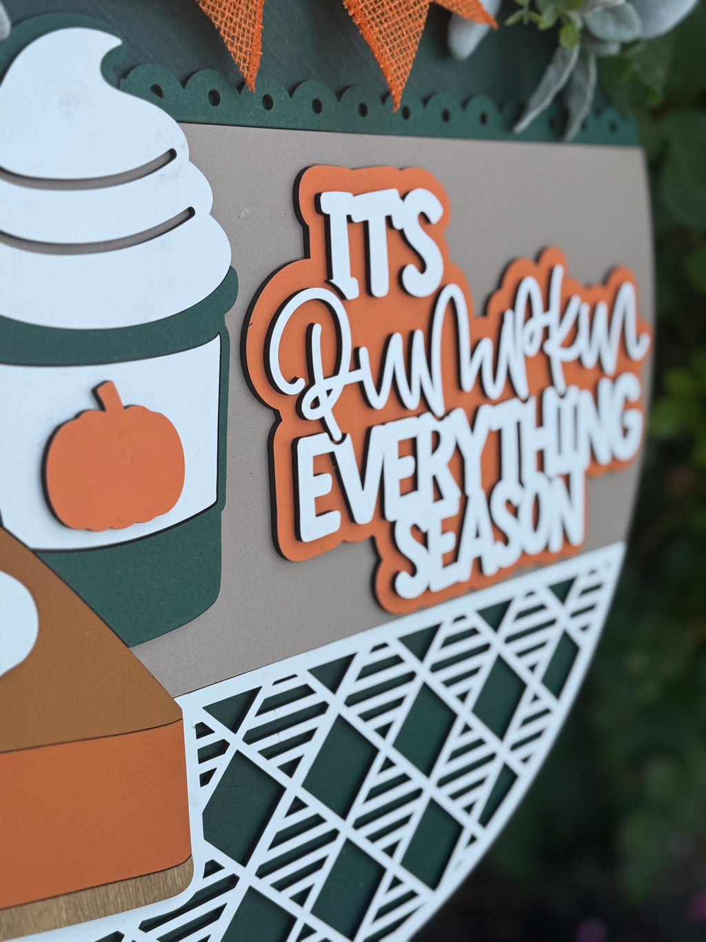 The "It’s Pumpkin Everything Season Door Sign" is a laser-cut wood front door hanger with a coffee cup, pumpkin, whipped cream, and bold text—perfect autumn farmhouse decor or wreath for fall and PSL lovers.