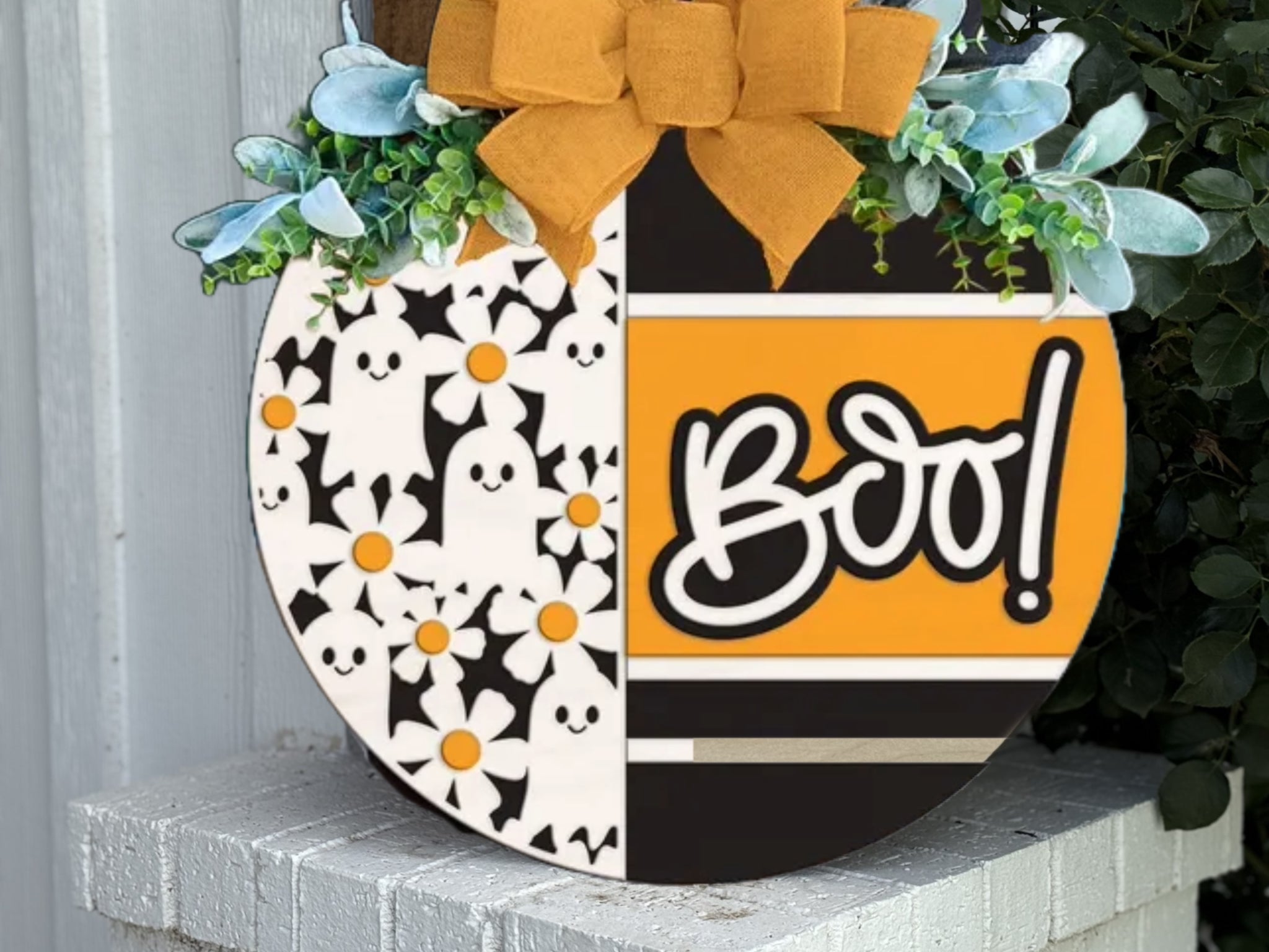 A sign with a bow on it.