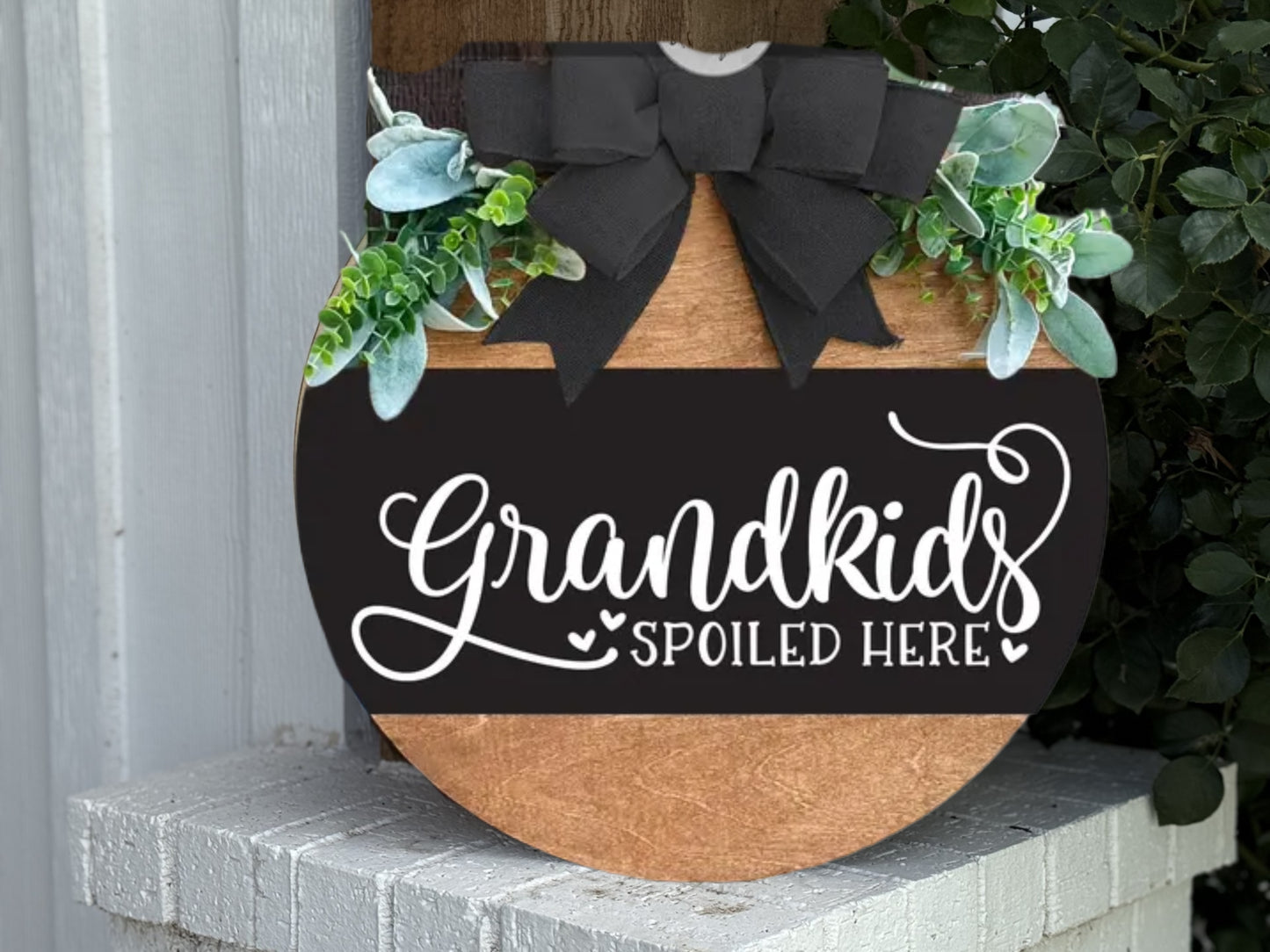 A round rustic wooden door hanger with “No One’s Home Unless There’s Coffee” in white script, perfect as farmhouse kitchen or porch decor for coffee lovers.