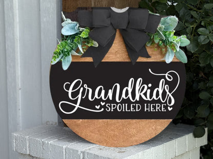 A round rustic wooden door hanger with “No One’s Home Unless There’s Coffee” in white script, perfect as farmhouse kitchen or porch decor for coffee lovers.