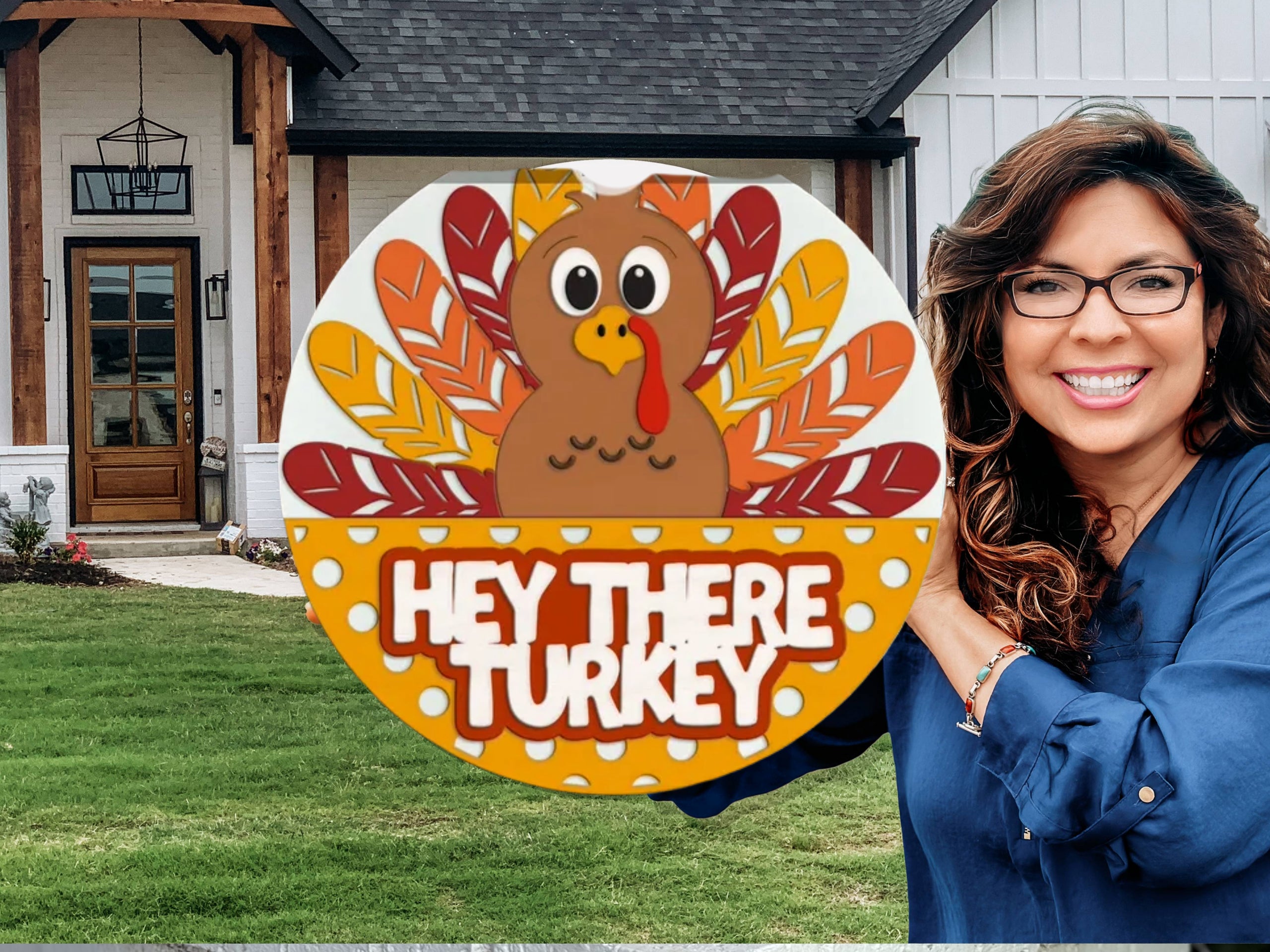 A smiling woman stands outside a house, holding a colorful round sign with a cartoon turkey and the words HEY THERE TURKEY in bold white letters. The house and green lawn are visible in the background.
