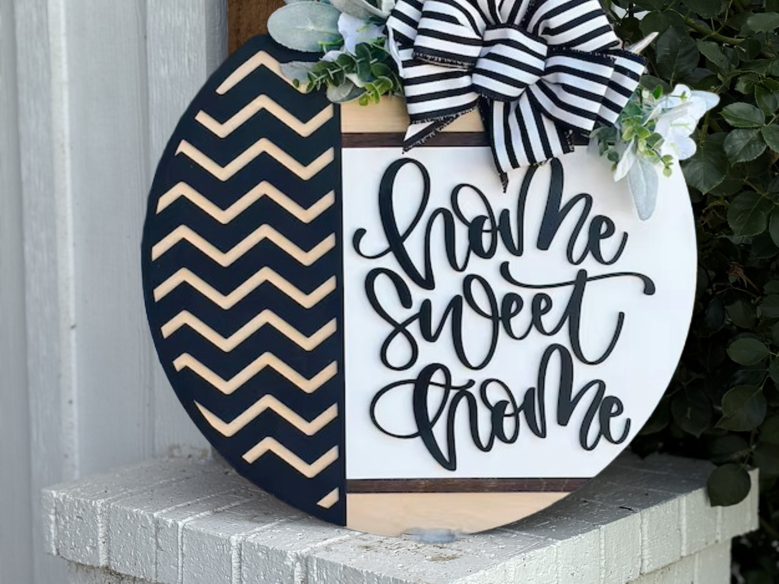 Home Sweet Home Door Hanger • Modern Chevron Round Wood Sign • Black & White Front Door Decor • Farmhouse Entryway Sign with Bow & Greenery