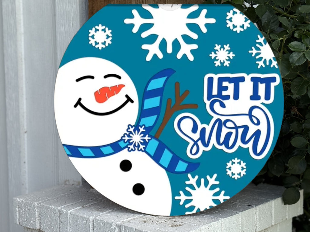 A blue and white sign with a snowman and snowflakes.