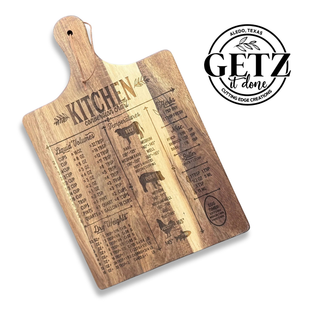 A wooden cutting board engraved with a kitchen conversion chart for liquid volumes and temperatures. It features illustrations of measuring cups and spoons. Next to the board is a black circular logo with the text GETZ it done and Aledo, Texas with Cutting Edge Creations.