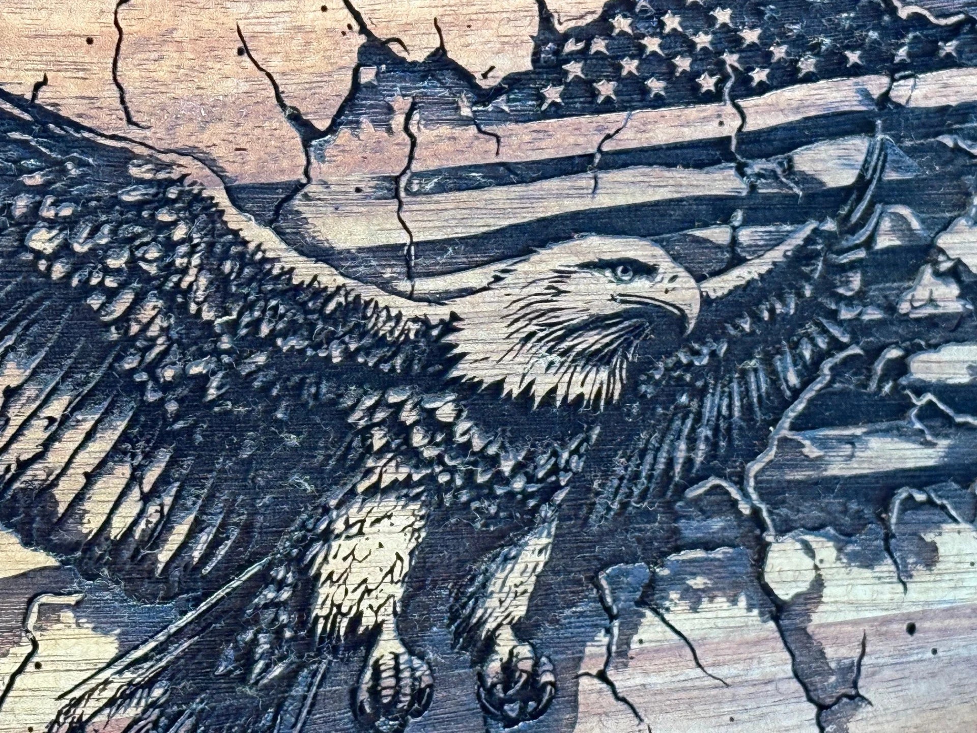 The Patriotic Eagle Engraved Acacia Wood Cutting Board features a detailed bald eagle with outstretched wings against a vintage-style American flag, highlighting its powerful and majestic presence.