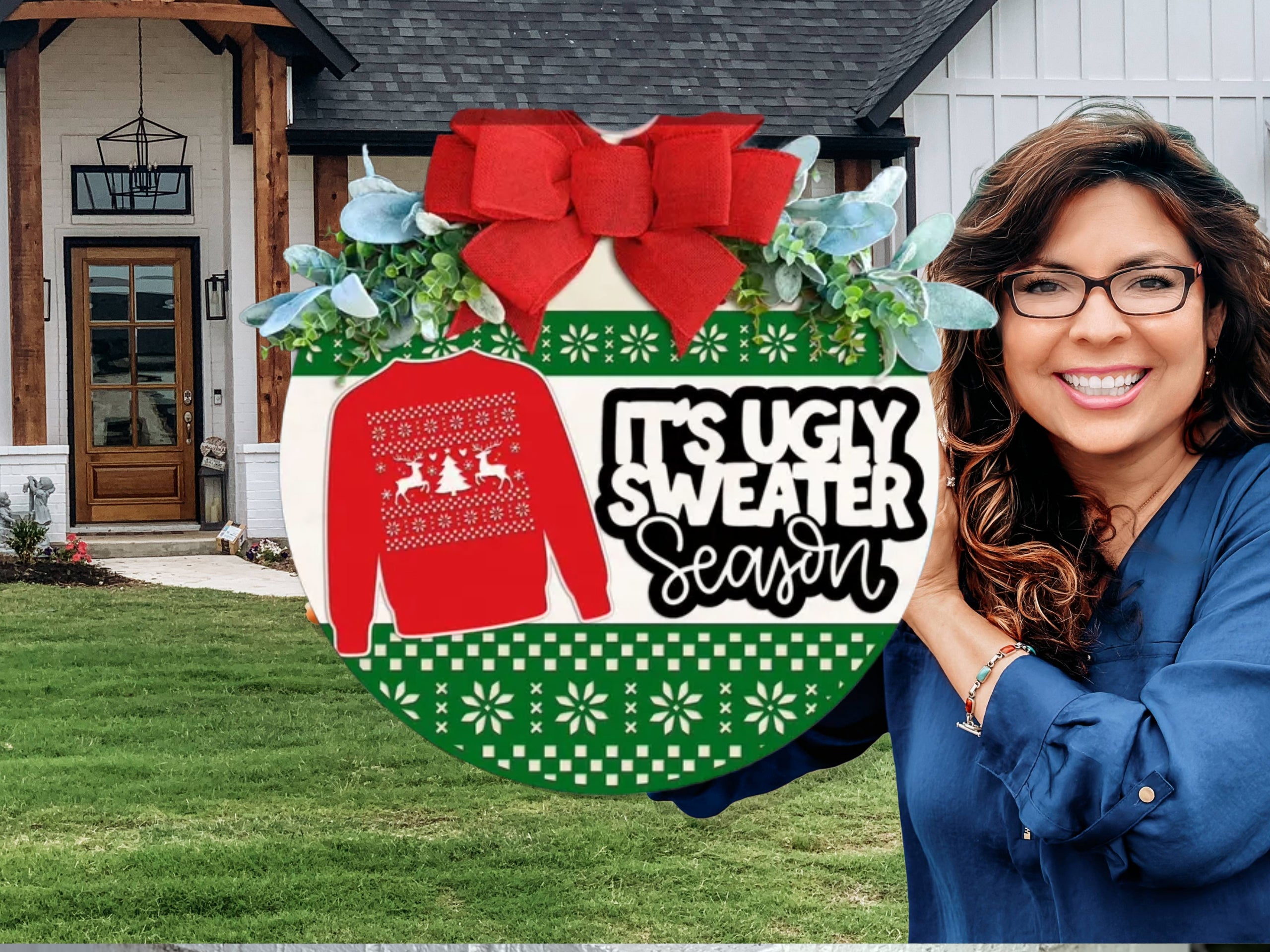 A festive sign with a red bow, greenery, and a red sweater graphic reads Its Ugly Sweater Season on a green and white patterned background, displayed on a white brick ledge.